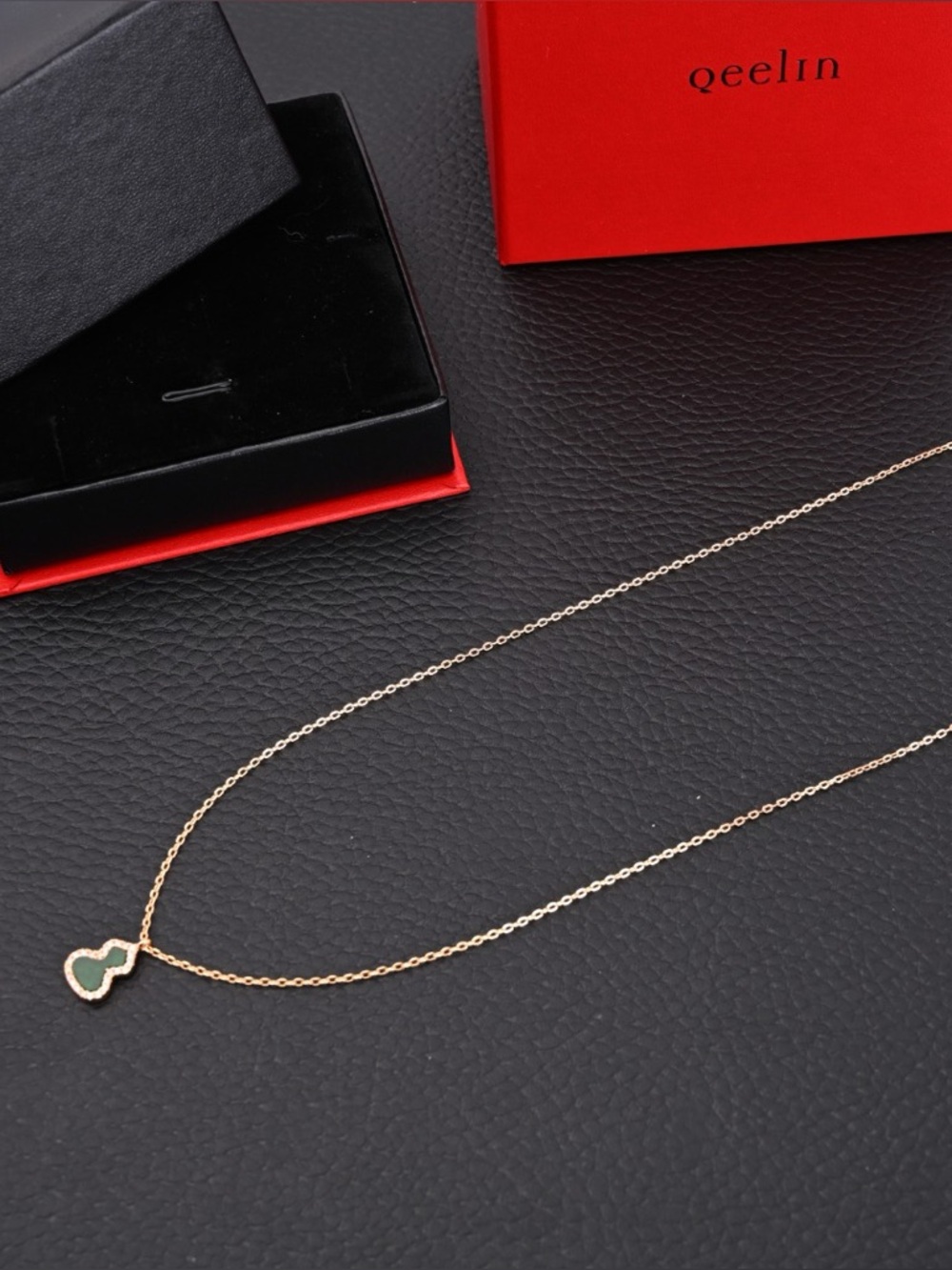 Gold Necklace with Green Heart Accent